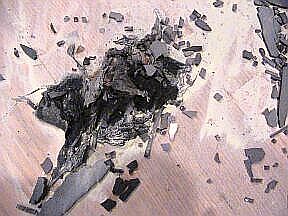 A big blob of plastic that fell, flaming, to the floor